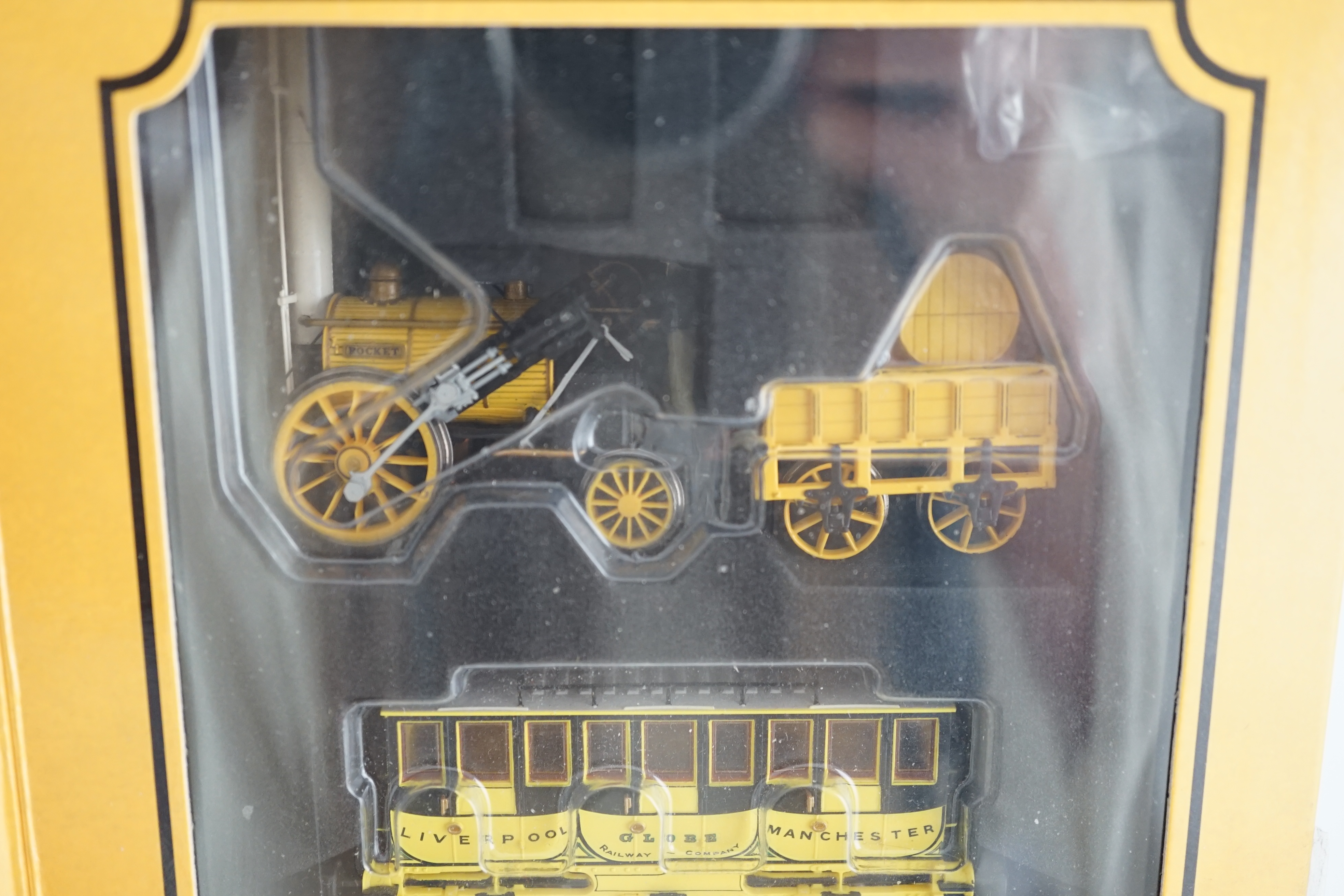 A Hornby Hobbies 00 gauge Rocket train pack (R3810), comprising of Stephenson’s locomotive Rocket and three Liverpool and Manchester 4-wheel coaches